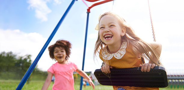 girls-children-kids-playing-swings-friends-fun-playground-outdoors-612x300.jpg